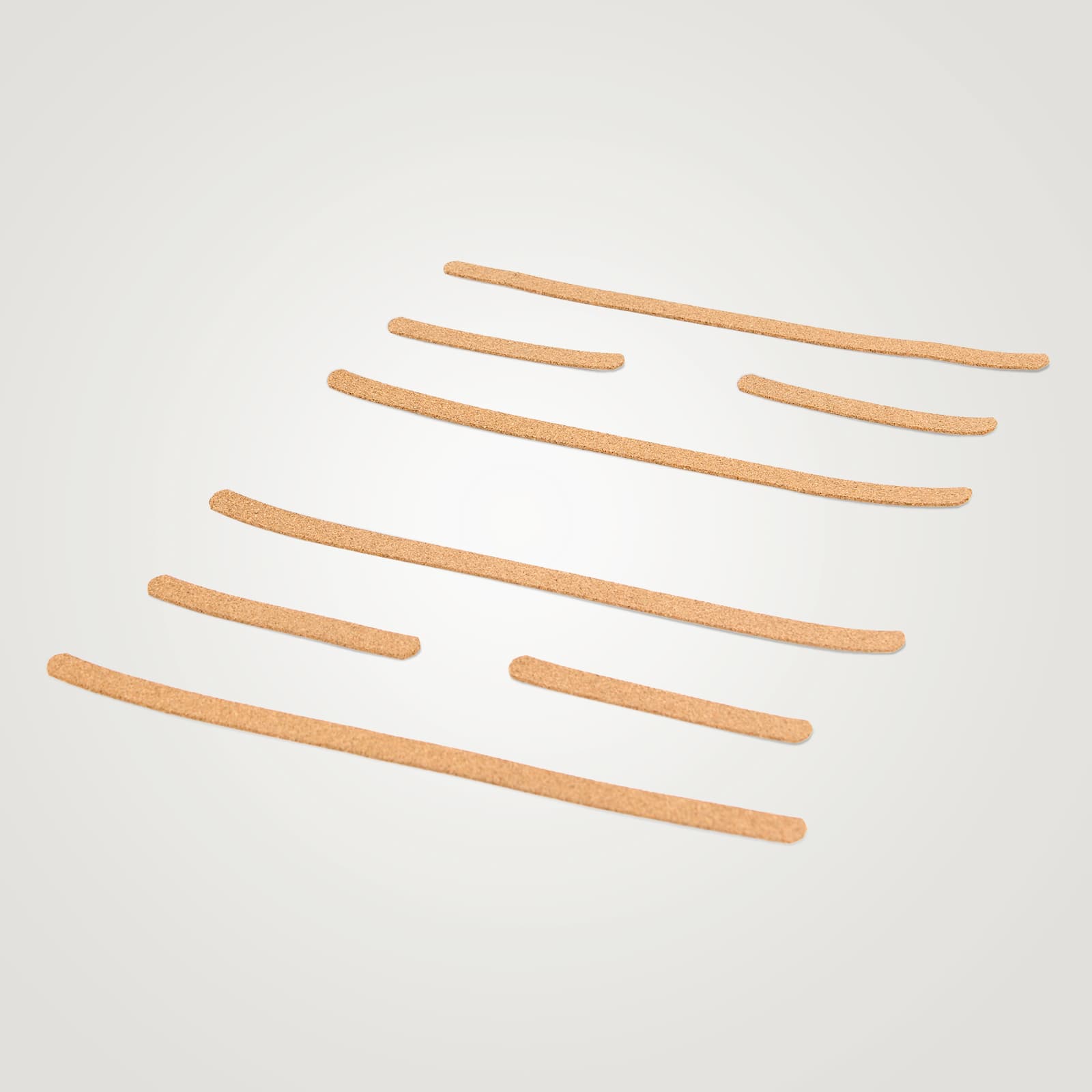 Freigestelltes Set aus acht passgenauen, sandfarbenen Gripstreifen für das rollholz Balanceboard, strukturiert angeordnet auf weißem Hintergrund.
